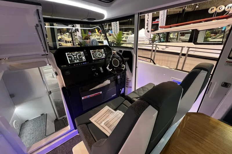 Slide: The Image of 2026 Axopar 37 XC Cross Cabin interior with modern dashboard and seating. - 28
