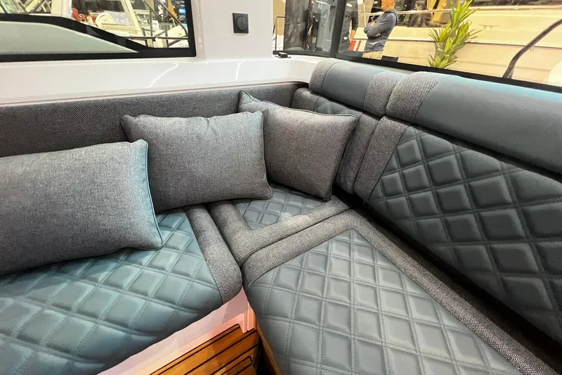 Slide: The Image of Luxurious interior seating of 2026 Axopar 37 XC Cross Cabin with quilted cushions. - 35