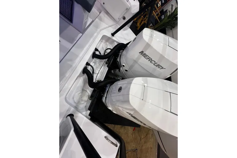 Slide: The Image of 2026 Axopar 37 XC Cross Cabin with dual Mercury outboard engines. - 39