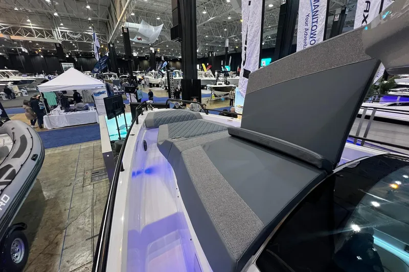 Slide: The Image of 2026 Axopar 37 XC Cross Cabin showcased at a boat exhibition, featuring sleek design. - 4