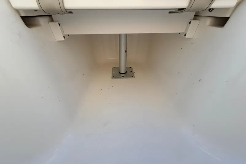Slide: The Image of 2023 Key West 219 FS boat interior storage compartment with white finish. - 13