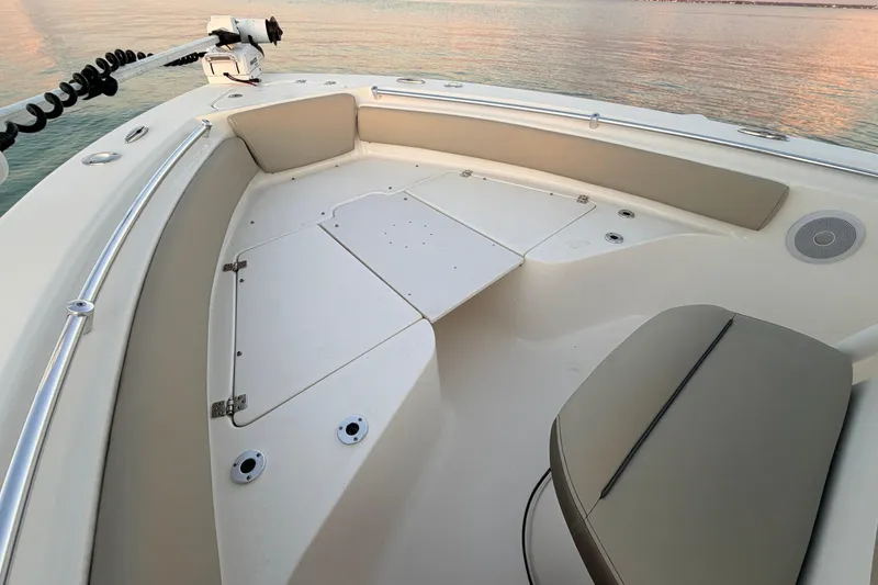 Slide: The Image of 2023 Key West 219 FS boat interior with seating and storage compartments. - 15
