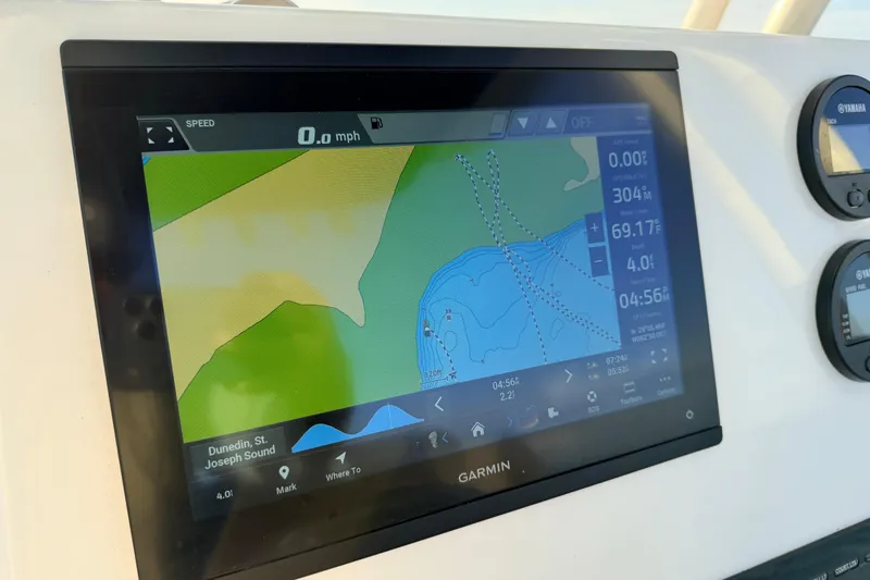 Slide: The Image of Garmin navigation display on 2023 Key West 219 FS boat, showing map and data. - 28