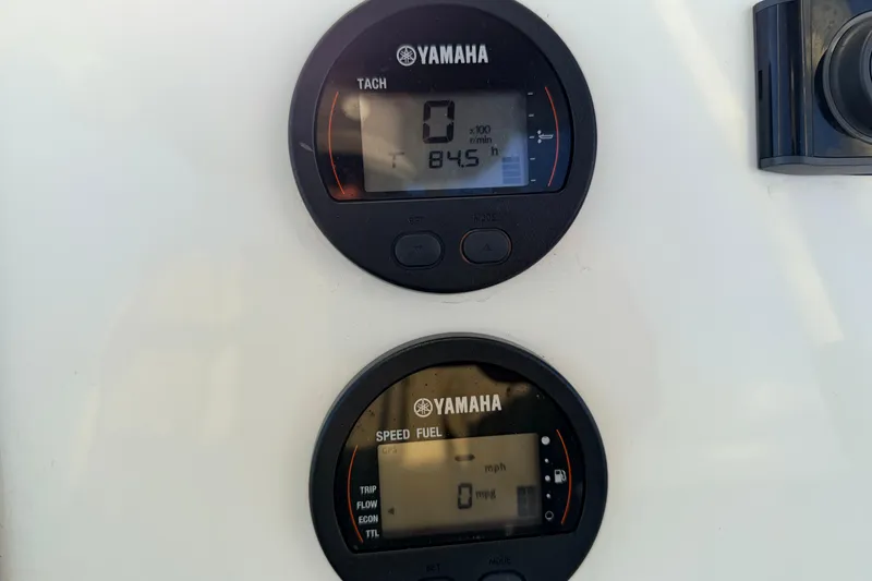 Slide: The Image of Yamaha digital gauges on 2023 Key West 219 FS boat dashboard, displaying tachometer and speedometer. - 29