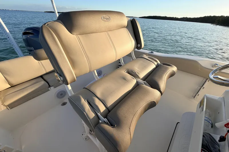 Slide: The Image of 2023 Key West 219 FS boat interior with comfortable seating and ocean view. - 37