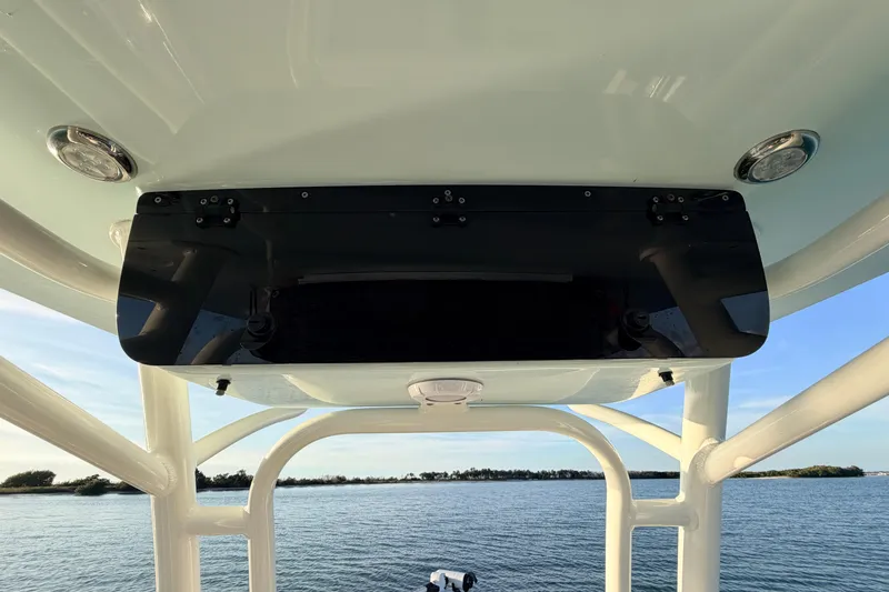 Slide: The Image of 2023 Key West 219 FS boat console with ocean view in the background. - 38