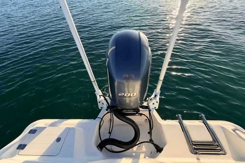 Slide: The Image of 2023 Key West 219 FS boat with Yamaha 200 engine on calm water. - 45