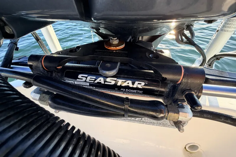 Slide: The Image of Close-up of SeaStar hydraulic steering on 2023 Key West 219 FS boat. - 49