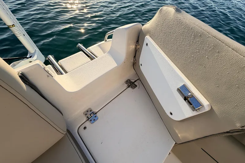 Slide: The Image of 2023 Key West 219 FS boat interior with seating and water view. - 50