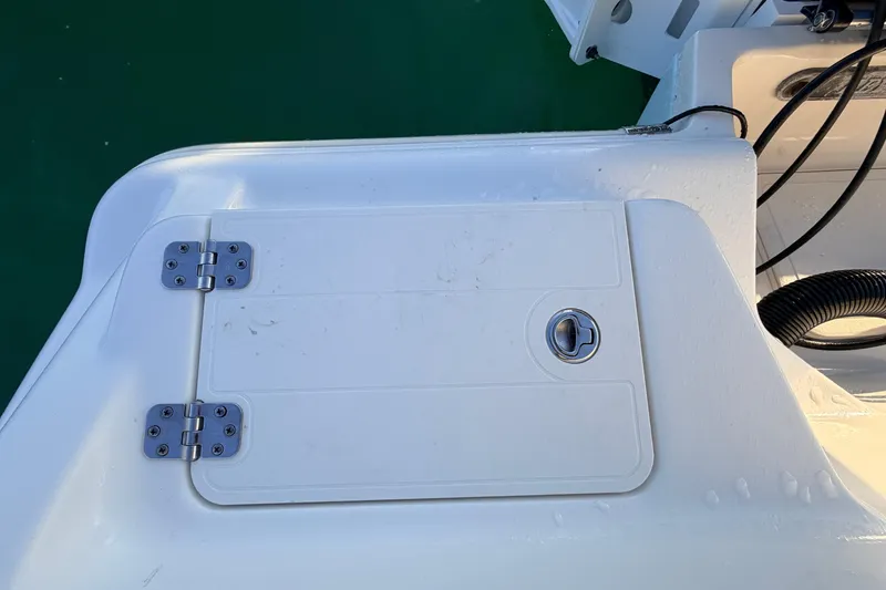 Slide: The Image of 2023 Key West 219 FS boat hatch with stainless steel hinges and latch. - 54