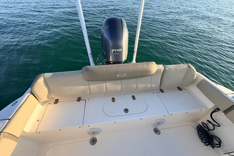 Slide: The Image of 2023 Key West 219 FS boat with Yamaha 200 engine on calm water. - 56