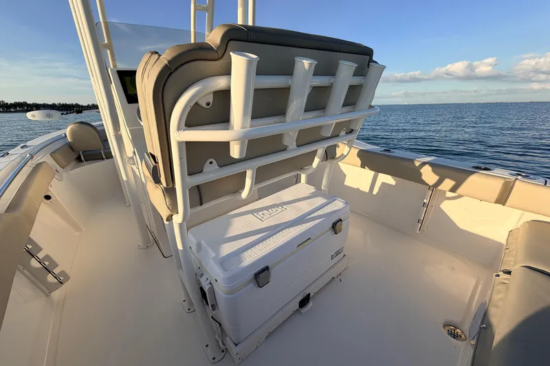 Slide: The Image of 2023 Key West 219 FS boat interior with seating and cooler, ocean view. - 58