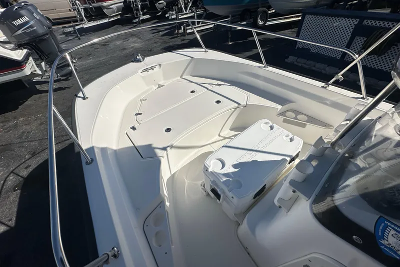 Slide: The Image of 2021 Boston Whaler 170 Montauk boat interior with seating and storage compartments. - 6