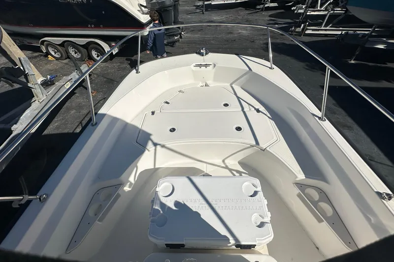 Slide: The Image of 2021 Boston Whaler 170 Montauk boat interior with seating and storage compartments. - 7