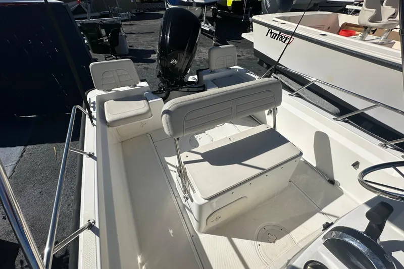 Slide: The Image of 2021 Boston Whaler 170 Montauk boat interior with seating and steering console. - 9