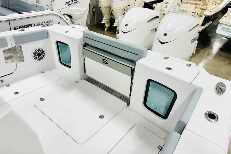 Slide: The Image of 2026 Sportsman Open 302 Center Console boat interior with seating and storage compartments. - 15