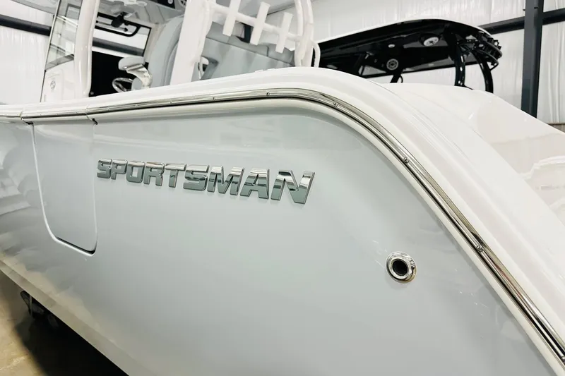 Slide: The Image of 2026 Sportsman Open 302 Center Console boat, sleek white exterior with chrome detailing. - 17