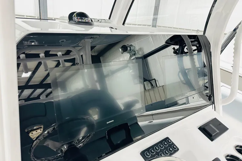 Slide: The Image of 2026 Sportsman Open 302 Center Console dashboard with modern navigation equipment. - 3