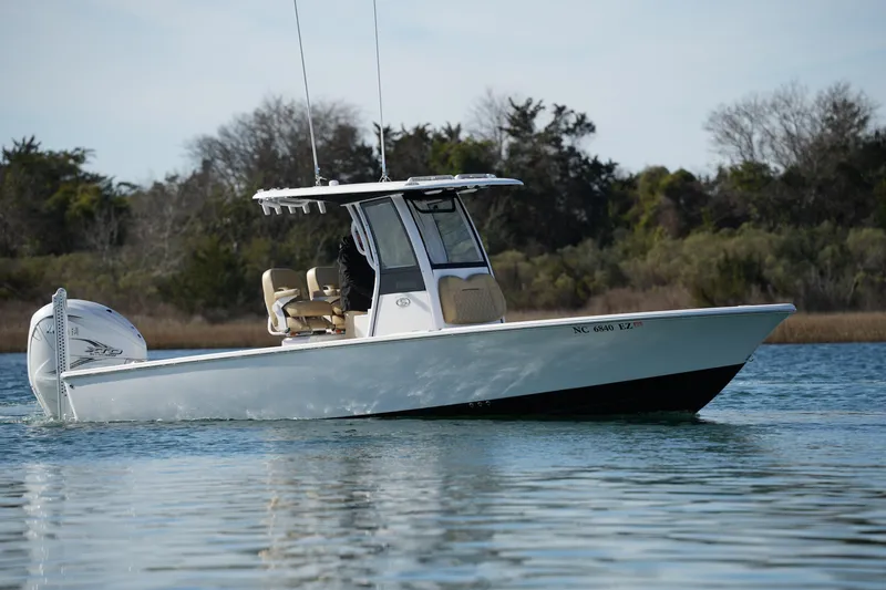 Slide: The Image of 2023 Sportsman Masters 267 Bay Boat cruising on calm water. - 12