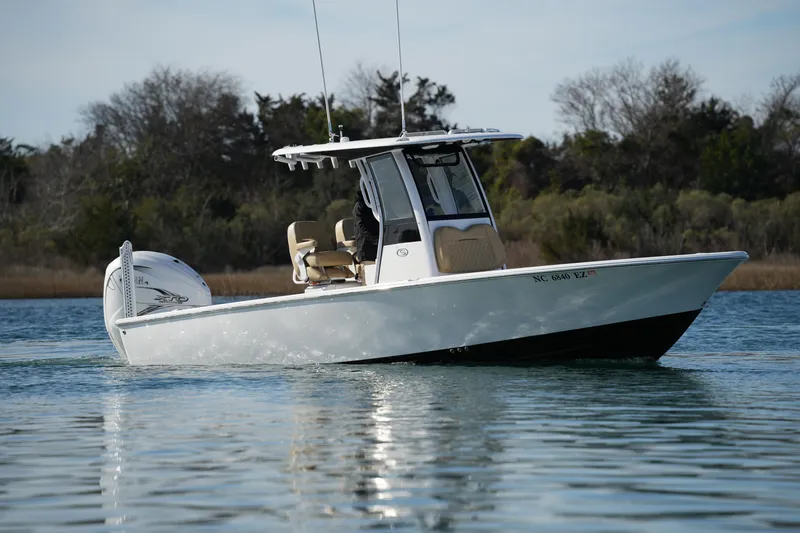 Slide: The Image of 2023 Sportsman Masters 267 Bay Boat cruising on calm water. - 13