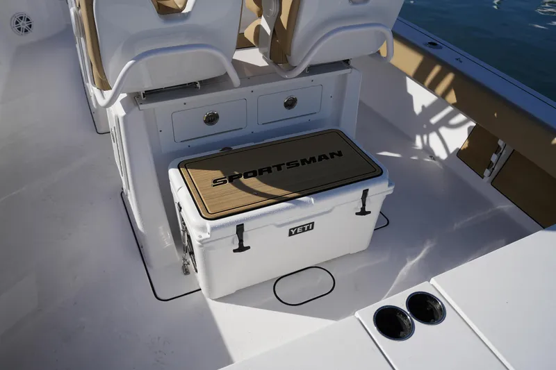 Slide: The Image of 2023 Sportsman Masters 267 Bay Boat interior with Yeti cooler and seating. - 23