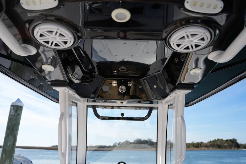 Slide: The Image of 2023 Sportsman Masters 267 Bay Boat interior with speakers and control panel. - 32