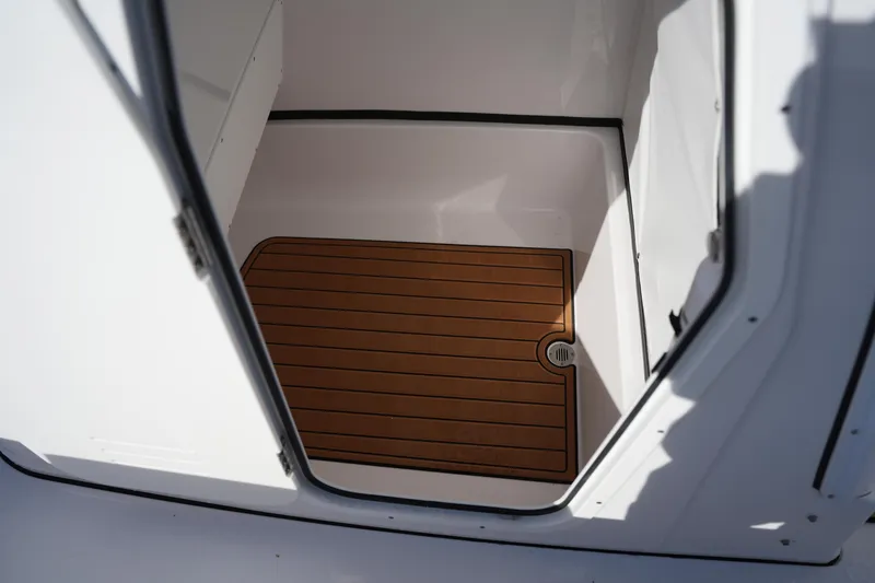 Slide: The Image of 2023 Sportsman Masters 267 Bay Boat interior with teak-style flooring. - 35