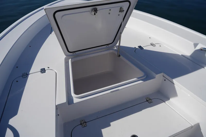 Slide: The Image of 2023 Sportsman Masters 267 Bay Boat storage compartment open on deck. - 41