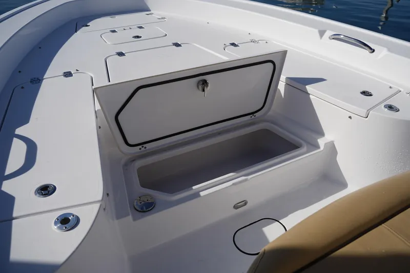 Slide: The Image of 2023 Sportsman Masters 267 Bay Boat with open storage compartment on deck. - 43