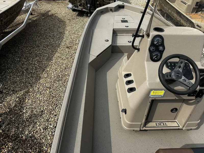 Slide: The Image of 2026 Excel 220 Bay Pro Elite boat cockpit view. - 8