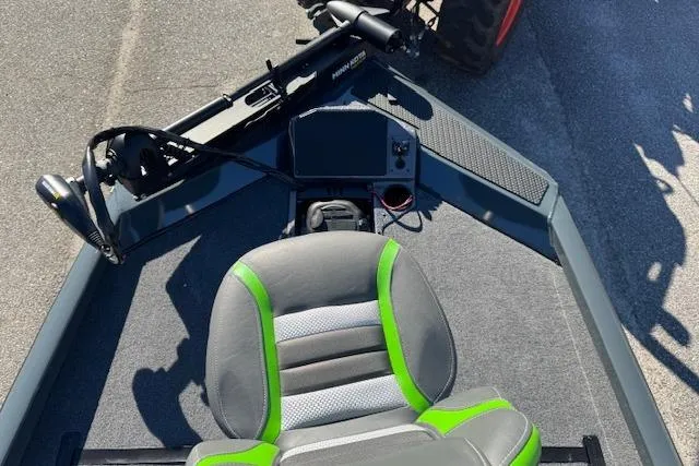 Slide: The Image of 2025 Ranger RT198P boat interior with steering wheel and green-accented seat. - 12
