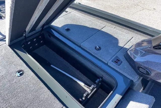 Slide: The Image of Open storage compartment in 2025 Ranger RT198P boat, showcasing interior space and design. - 17