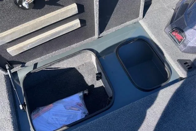 Slide: The Image of 2025 Ranger RT198P boat storage compartments with open hatch and visible interior. - 18