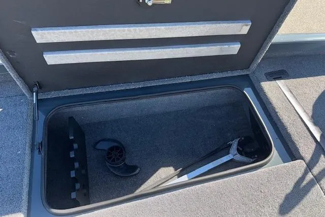 Slide: The Image of Storage compartment in 2025 Ranger RT198P boat with tools and accessories. - 19