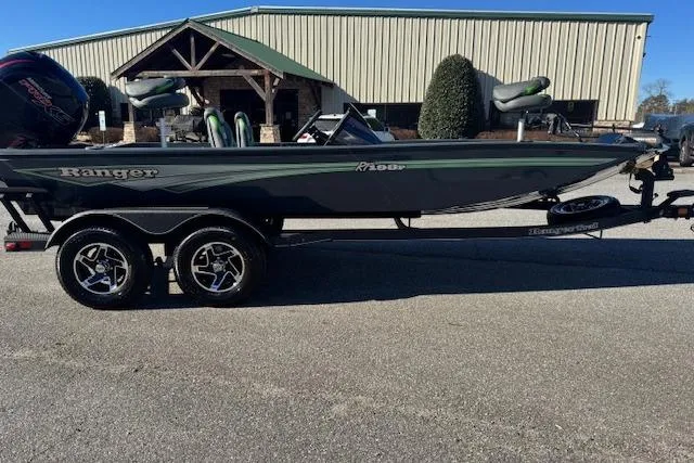 Slide: The Image of 2025 Ranger RT198P boat on trailer, parked outdoors near a building. - 4