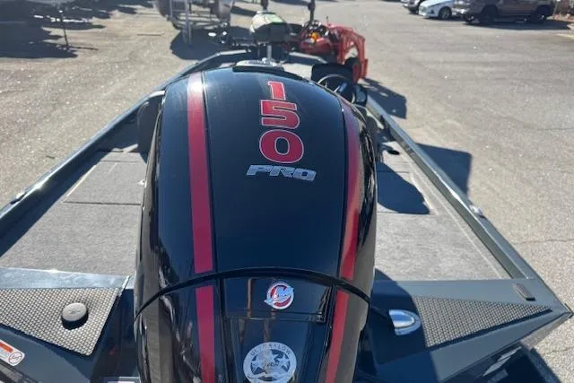 Slide: The Image of 2025 Ranger RT198P boat with 150 Pro engine, parked outdoors. - 6