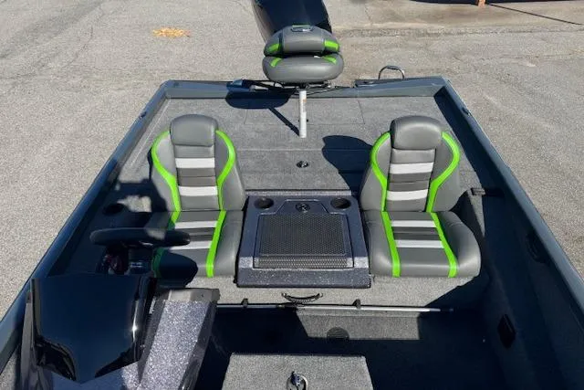 Slide: The Image of 2025 Ranger RT198P boat interior with gray and green seats, steering console, and storage compartments. - 8