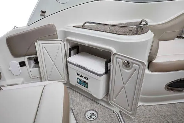 Slide: The Image of 2026 Crownline 270 CR boat interior with Igloo cooler storage compartment. - 13