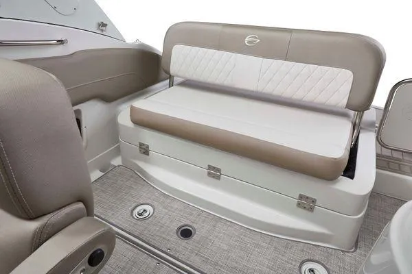 Slide: The Image of 2026 Crownline 270 CR boat interior with beige seating and storage compartment. - 14