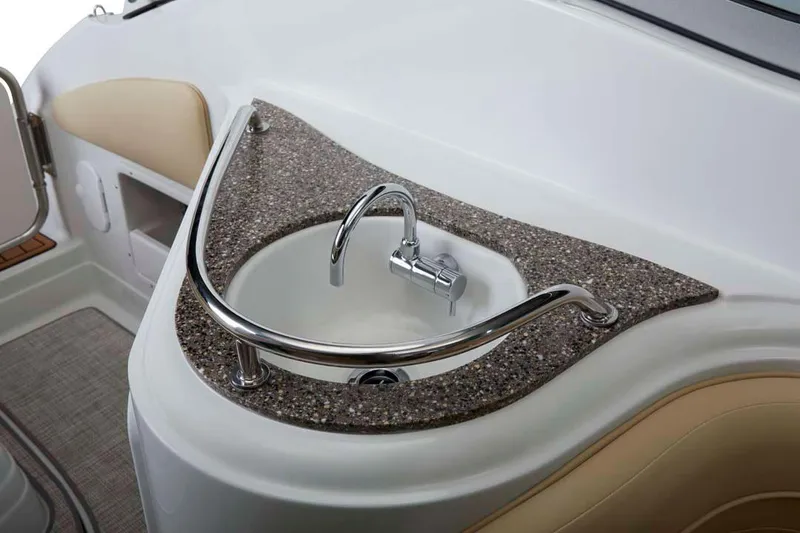 Slide: The Image of Manufacturer Provided Image: 2026 Crownline 270 CR boat sink with modern faucet and granite countertop. - 8