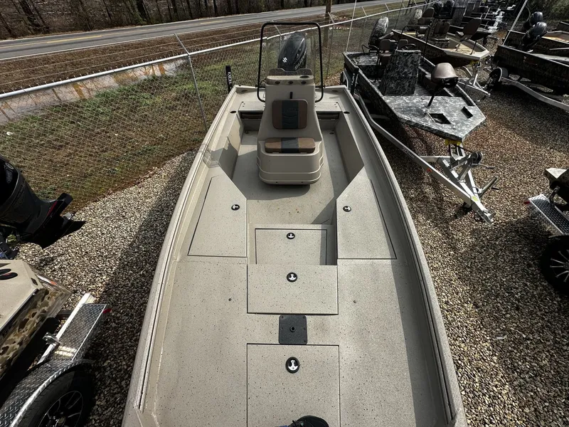 Slide: The Image of 2026 Excel 220 Bay Pro Elite boat on gravel lot. - 4