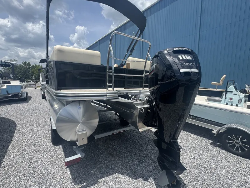 Slide: The Image of 2026 Lowe LS Walk Thru 210 with a Mercury 115 HP outboard motor, on a trailer. - 4