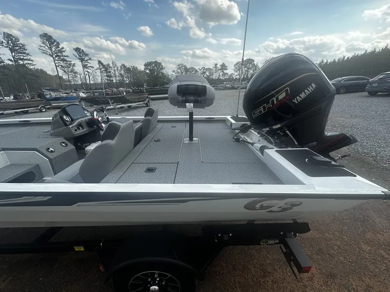 Slide: The Image of 2026 G3 Sportsman 1710 boat with Yamaha engine outdoors. - 10