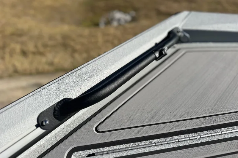 Slide: The Image of Close-up of Avid 16 Commander 2026 boat handle and textured surface. - 13