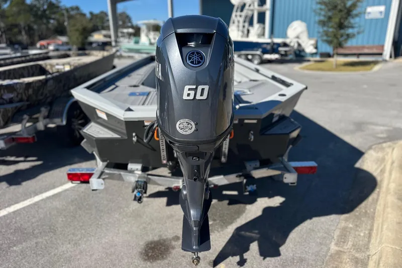 Slide: The Image of Avid 16 Commander 2026 boat with Yamaha 60 outboard motor on trailer. - 2