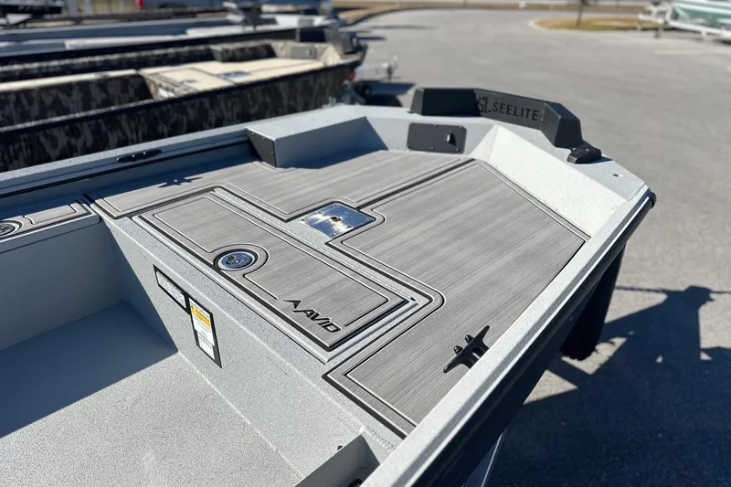 Slide: The Image of 2026 Avid 16 Commander boat with sleek deck design in a sunny outdoor setting. - 3