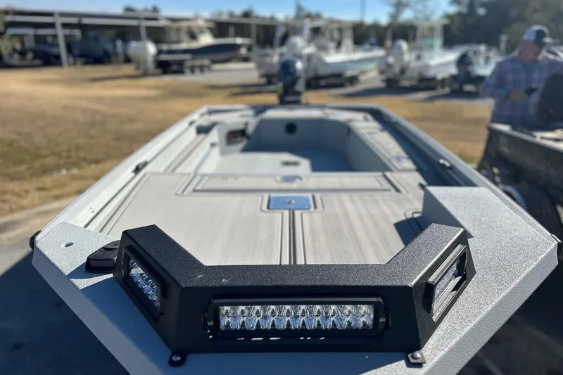 Slide: The Image of 2026 Avid 16 Commander boat with LED lights, displayed outdoors. - 6