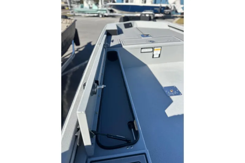 Slide: The Image of 2026 Avid 16 Commander boat interior with open storage compartment and sleek design. - 7