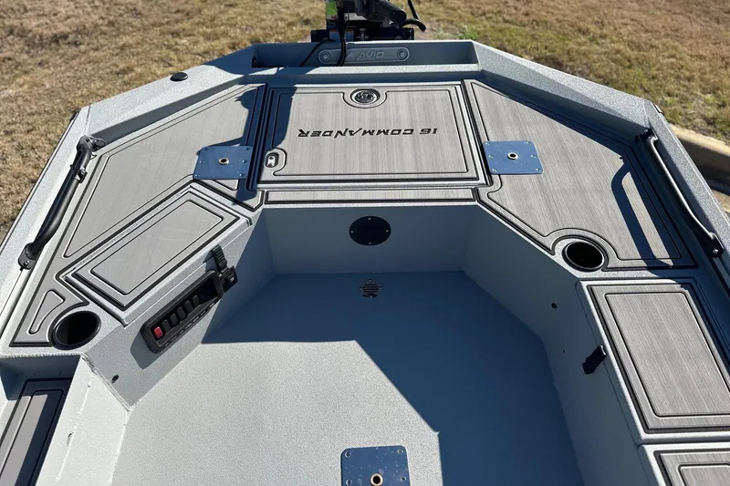 Slide: The Image of Avid 16 Commander 2026 boat interior with storage compartments and control panel. - 9
