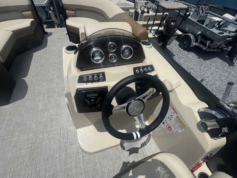Slide: The Image of The image shows the helm of a Lowe LS Walk Thru 210 boat with modern instruments. - 7